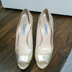 Gold Prada peep toe pumps